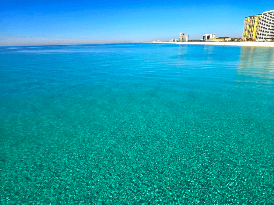 Crystal-clear emerald waters and white sand beaches in Navarre, Florida, near Pensacola.