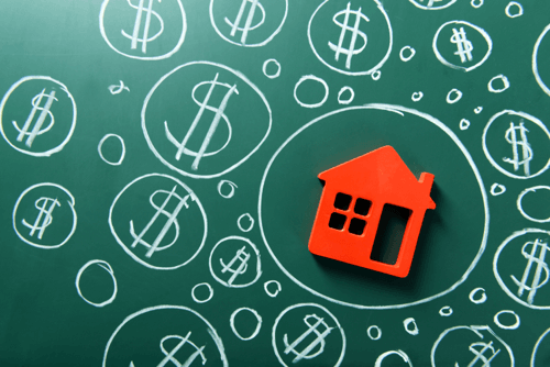 Red house icon surrounded by dollar signs drawn on a chalkboard, representing a Pensacola home value.