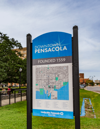 Downtown Pensacola sign with city map, highlighting area context for evaluating Pensacola home values.