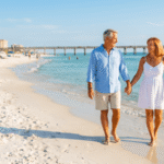 Retired couple walking hand in hand along the Florida Gulf Coast beaches near Pensacola
